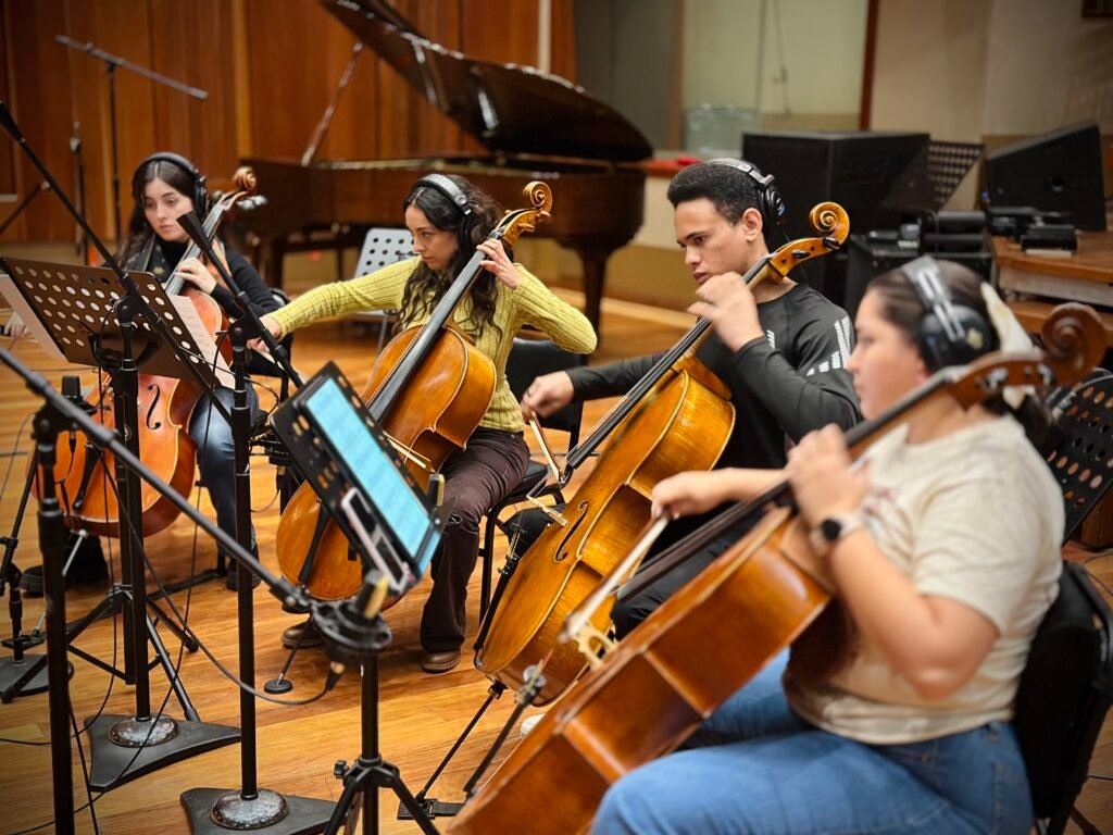 Professional string musicians recording live strings for a music production.